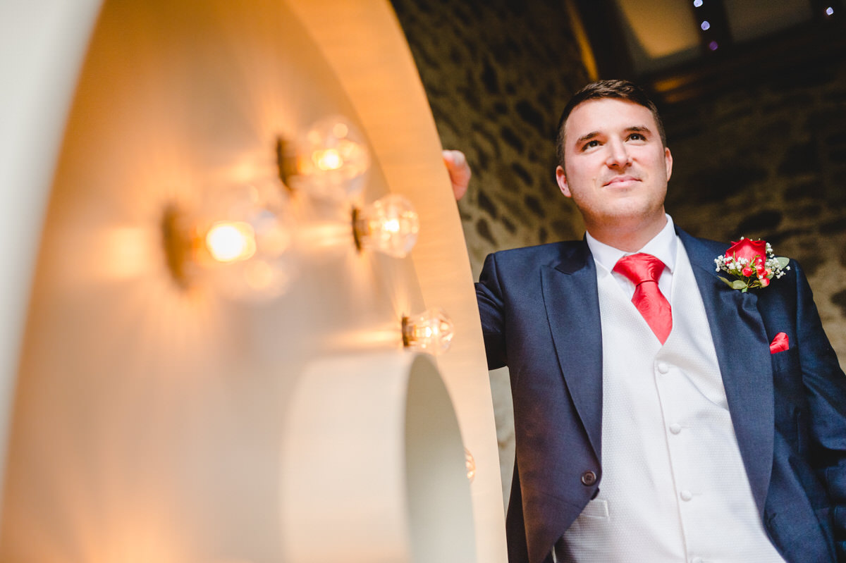 Groom posing before his bride arrives